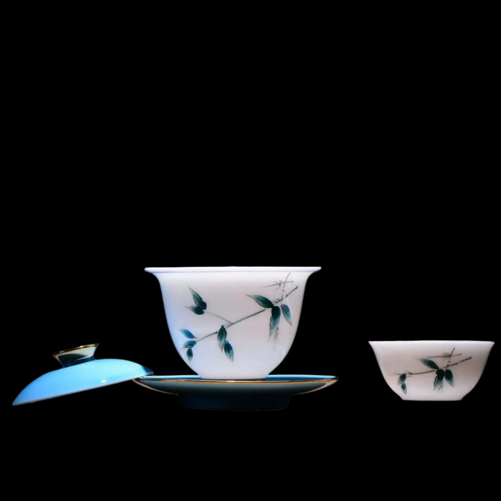 Open blue bamboo porcelain gaiwan with matching tea cup and saucer