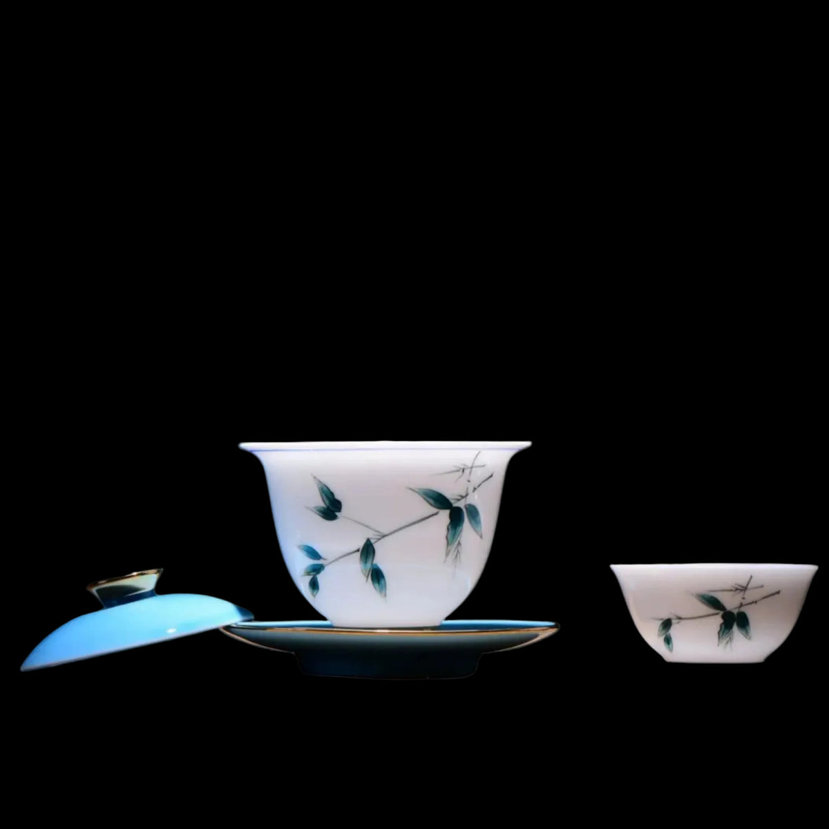 Open blue bamboo porcelain gaiwan with matching tea cup and saucer