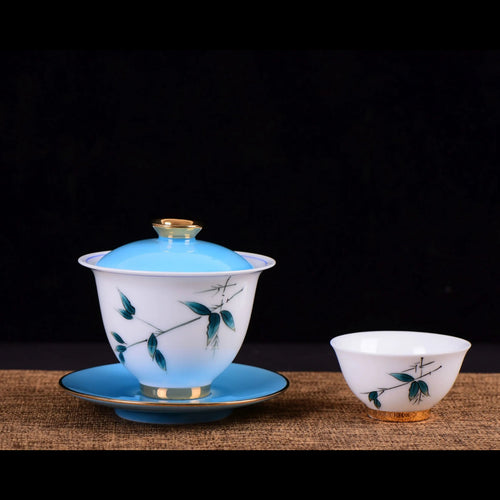 Jingdezhen porcelain gaiwan with blue bamboo design and matching tea cup