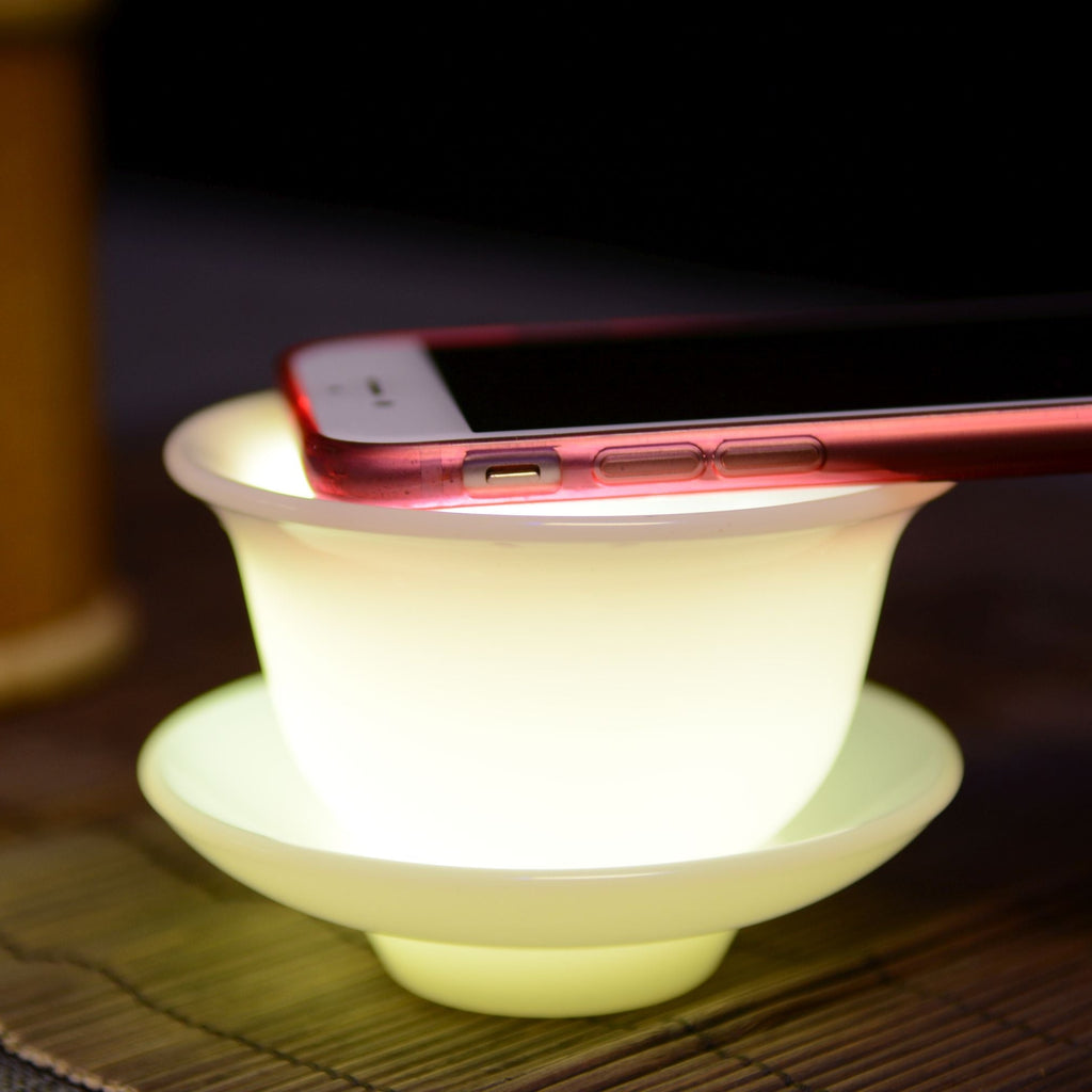 Dehua jade porcelain gaiwan illuminated to show its semi-translucent porcelain body