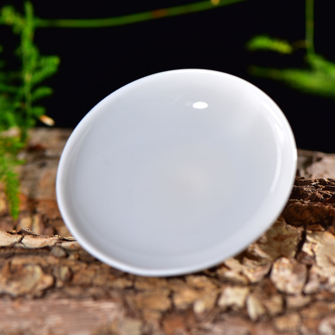 Interior view of gold on white Dehua jade porcelain gaiwan