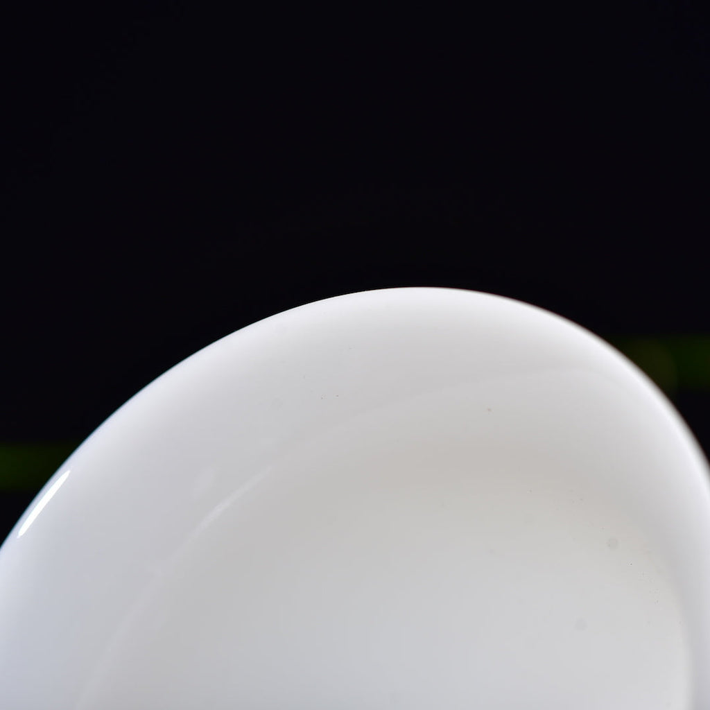 Close-up of the white porcelain rim on a Dehua jade porcelain gaiwan